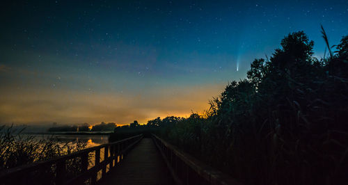 Panoramic view of silhouette trees against sky at night