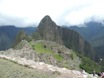 Scenic view of mountain against cloudy sky