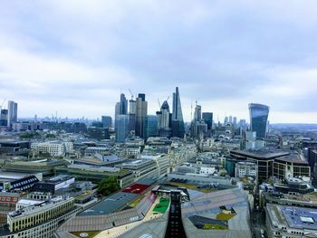 High angle view of buildings in city against sky