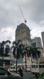 Cars on city against sky
