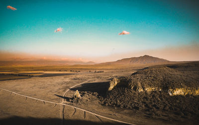 Scenic view of landscape against blue sky