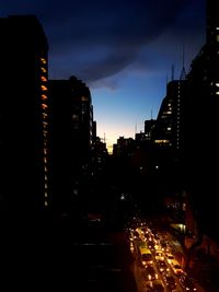 Illuminated buildings in city at night