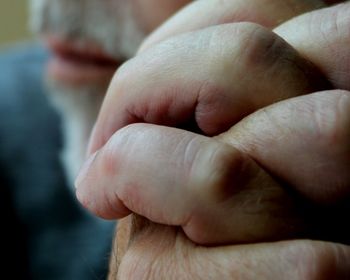 Close-up of man holding hands