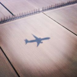 Shadow of airplane on runway
