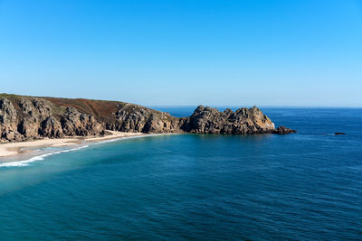 Scenic view of sea against clear blue sky