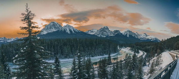 Scenic view of snowcapped mountains against sky during sunset