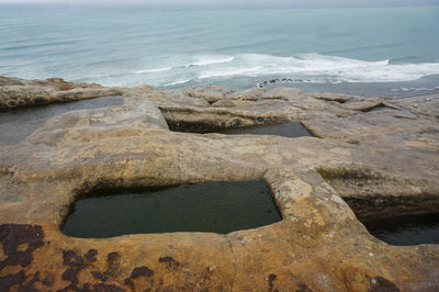 High angle view of rocks on beach