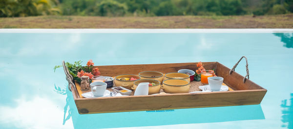 High angle view of food on table by swimming pool
