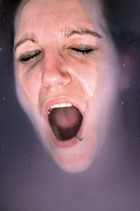 Close-up portrait of woman in water