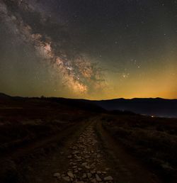 Scenic view of landscape against sky at night