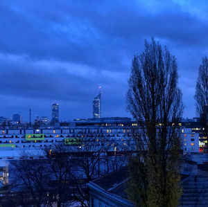 View of buildings in city at dusk