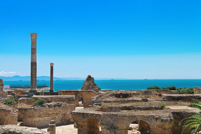 Ruins of building against blue sky