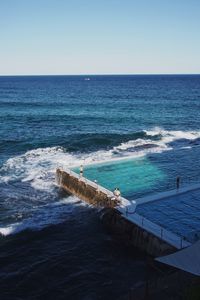 Scenic view of sea against blue sky