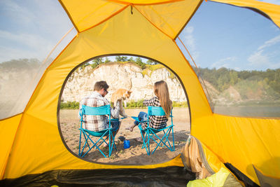 People sitting in tent