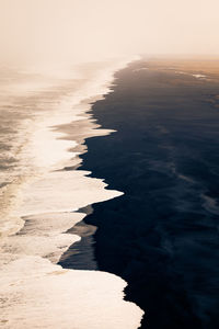 Scenic view of sea against sky at sunset