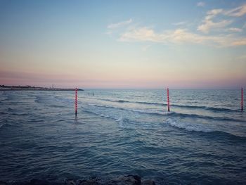 Scenic view of sea against sky at sunset