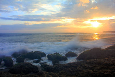 Scenic view of sea against sky during sunset