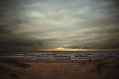 Scenic view of sea against cloudy sky