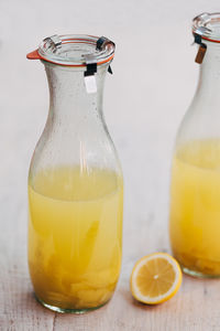 Close-up of limoncello in bottle on table