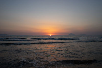 Scenic view of sea against sky during sunset