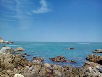 Scenic view of sea against clear blue sky