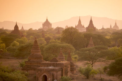 Old ruins of temples against clear sky