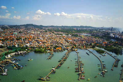 High angle view of crowded city against sky