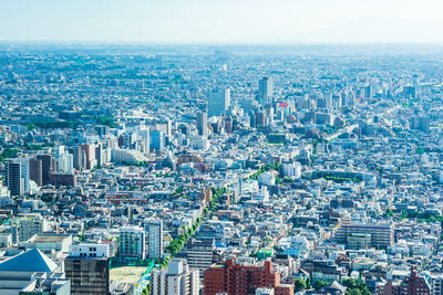 High angle view of modern buildings in city against sky