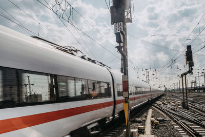 Train on railroad track against sky