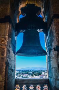 Low angle view of bell tower against sky