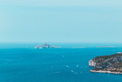 Scenic view of sea against blue sky