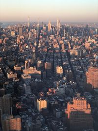 High angle view of modern buildings in city against sky