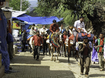 Group of people walking on road