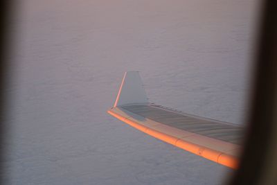 Airplane wing against sky