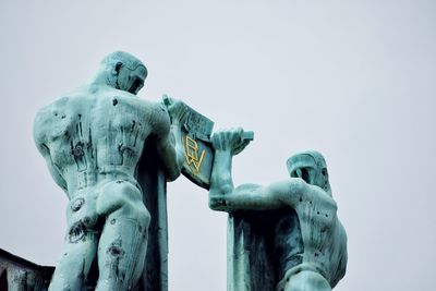 Low angle view of statue against sky