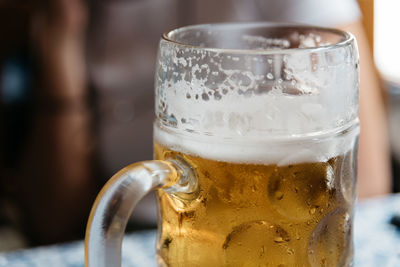 Close-up of beer glass on table