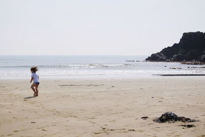 Boy running at beach