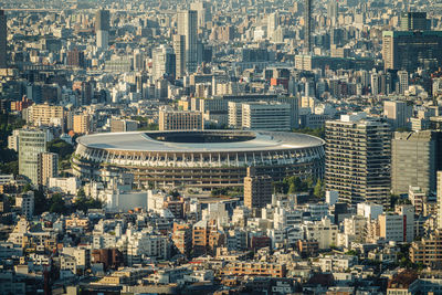 Looking at the national stadium from a distance under the setting sun