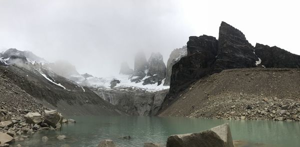 Panoramic view of lake and mountains against sky