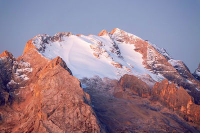 Scenic view of snowcapped mountains against clear sky