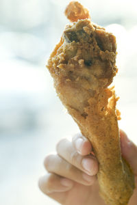 Close-up of hand holding ice cream