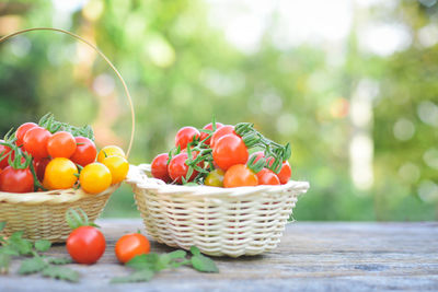 Close-up of cherry tomatoes in baskets on table