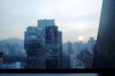 View of cityscape through window