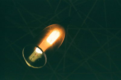 Close-up of illuminated light bulb