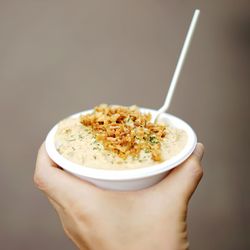 Close-up of hand holding ice cream