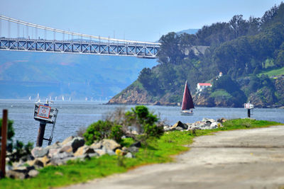 Bridge over sea against sky