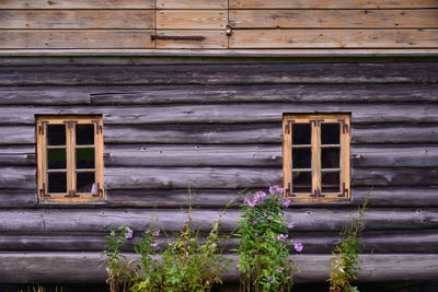 Low angle view of closed wooden door of building