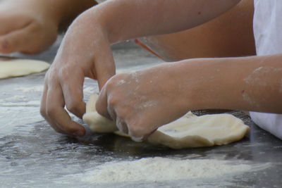 Midsection of girl preparing food