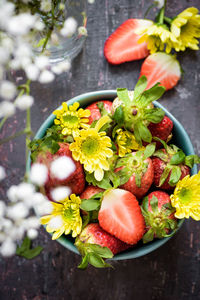 High angle view of strawberries in bowl on table