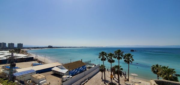 High angle view of sea against blue sky